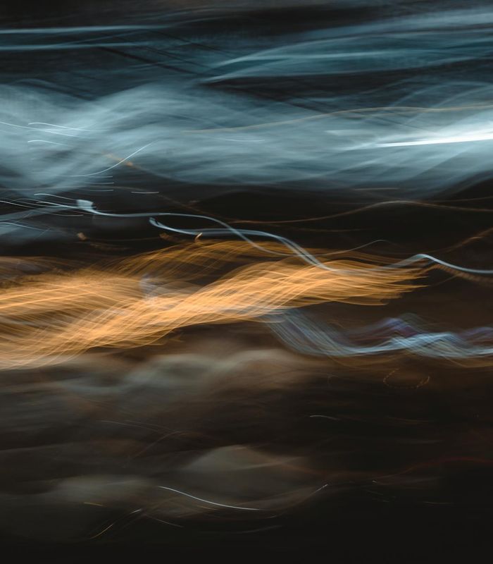 Abstract glowing lines representing fluid movement and energy flow